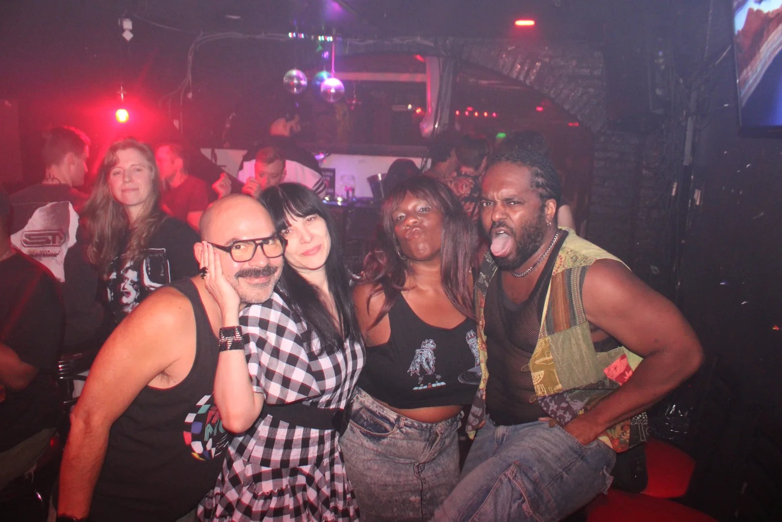 Friends celebrating at Scandalo — explore our next party